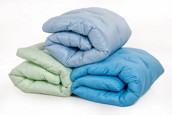 Três cobertores para baixo — Fotografia de Stock