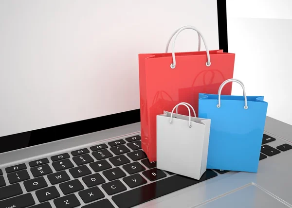 laptop and colorful shopping bags