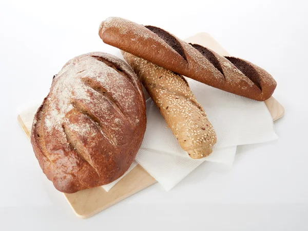 Different bread on white — Stock Image Different bread on white Stock Picture