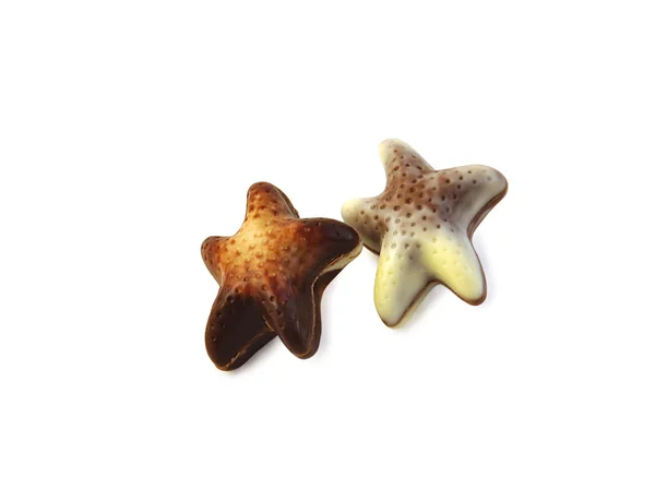 Choklad stjärnor i isolerade över vita med urklippsbana. — Stockfoto