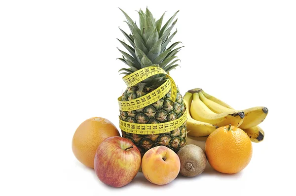 Fruits with measuring tape isolated over white. — Stock Photo, Image
