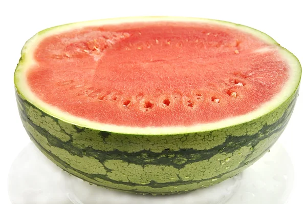 Cut watermelon with drops on plate isolated over white. — Stock Photo, Image