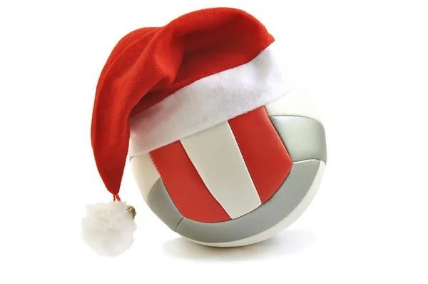 Beyaz bitti izole Noel Baba şapkası ile voleybol.
