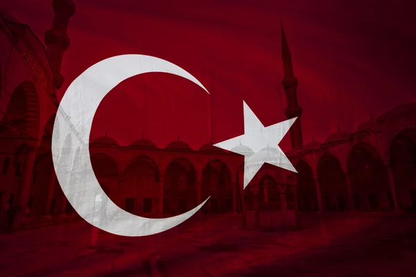 Turkish flag with view of Blue mosque courtyard in background — Stock Photo, Image