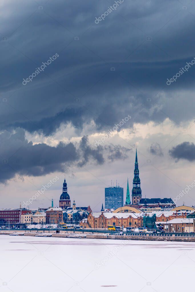 Riga skyline from middle of river frozen river Daugava