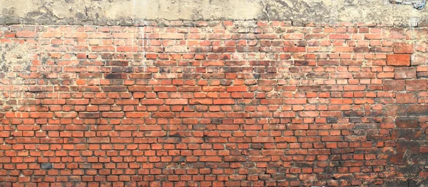 Alte Mauer mit roten Ziegeln — Stockfoto