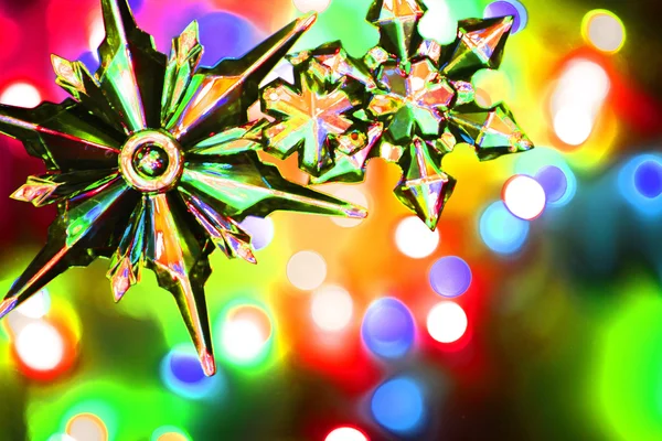 Copo de nieve y luces de Navidad color de fondo — Foto de Stock