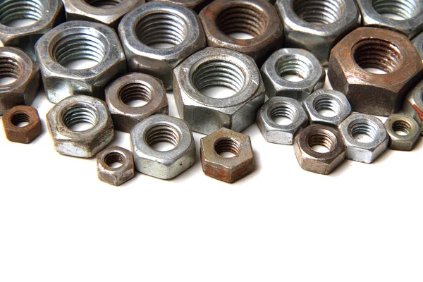 Steel nuts background — Stock Photo, Image