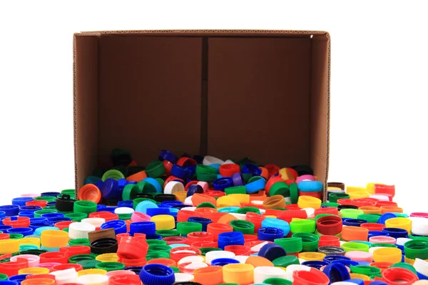 Pet caps in the paper box — Stock Photo, Image