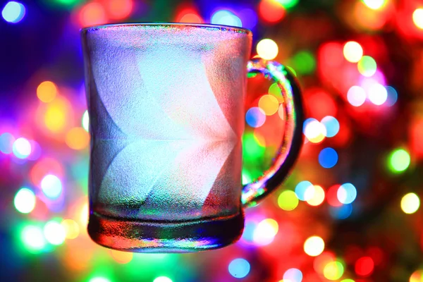 Glass cup on the christmas light — Stock Photo, Image