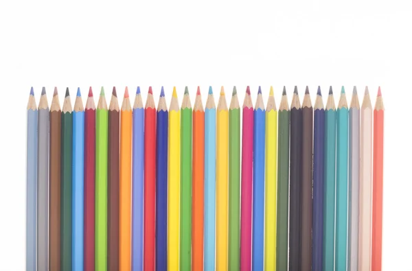 Vele kleurrijke potloden in een rij — Stockfoto