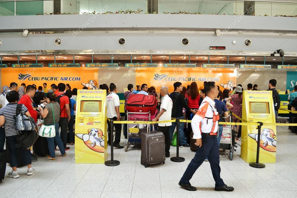 DAVAO, PHILIPPINES - APRIL 19, 2015: Cebu Pacific flights check in at Davao International Airport. Cebu Pacific is one of the most popular Filipino flying agency in the Philippines.