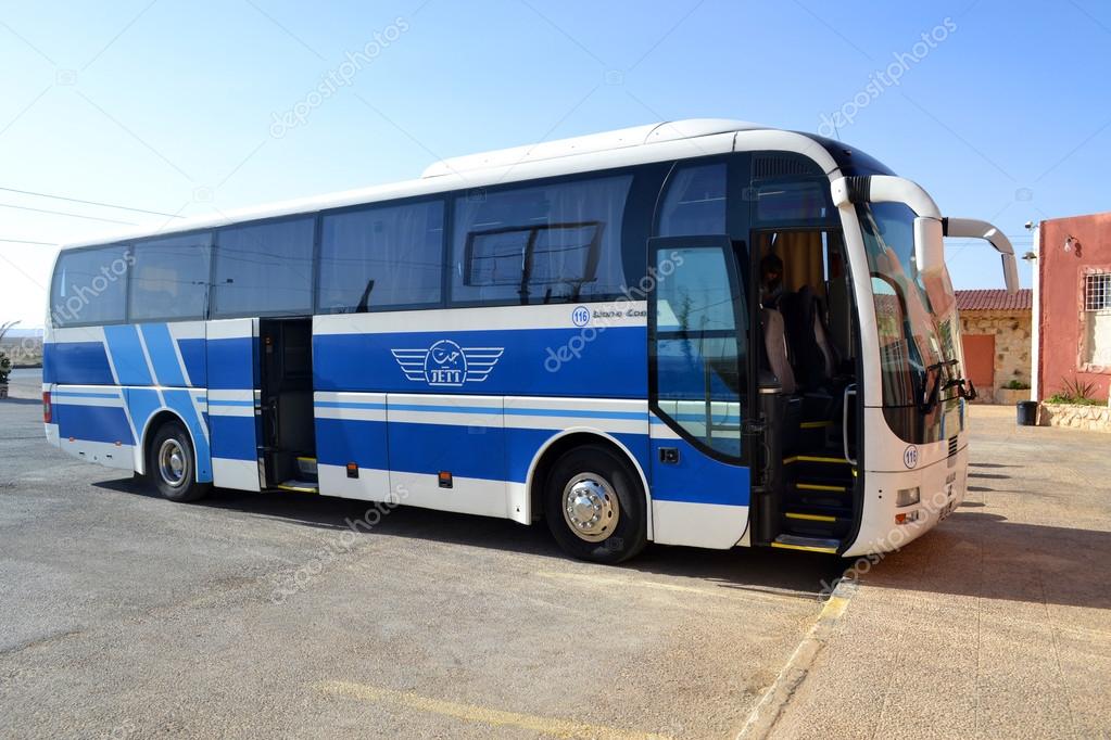 AMMAN, JORDAN - MAY 18, 2015: JETT bus parking in a touristic area.The Jordan Express Tourist Transportation company is serving tourists in Jordan since 1964.