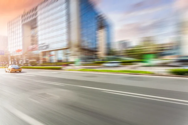 Car driving on road, motion blur — Stock Photo, Image