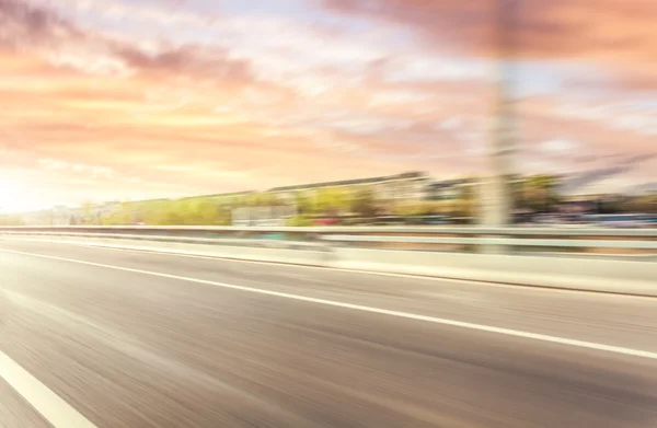 Car driving on road, motion blur — Stock Photo, Image