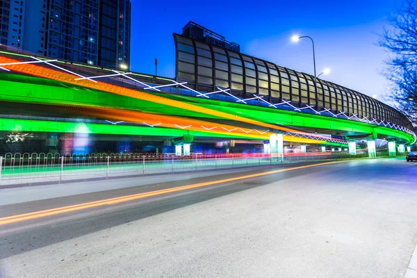 Light traces on traffic junctions at night — Stockfoto