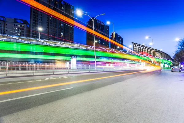 Light traces on traffic junctions at night — Stockfoto