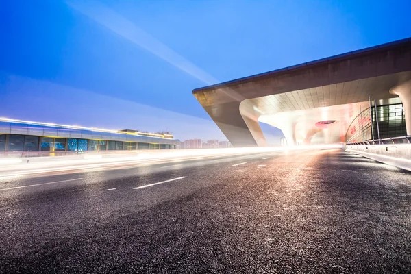 Light trails on the modern city at dusk in beijing,China — Stock Photo, Image