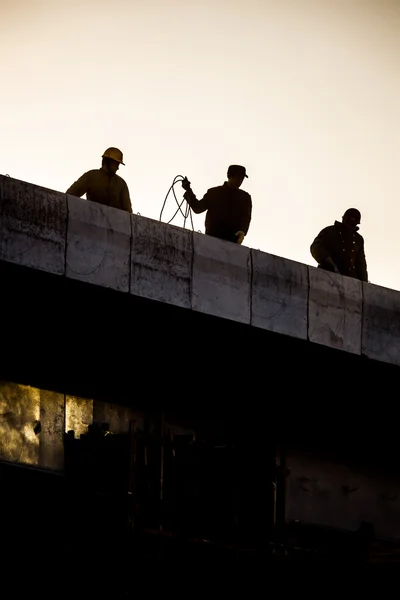Construction workers silhouette — Stock Photo, Image