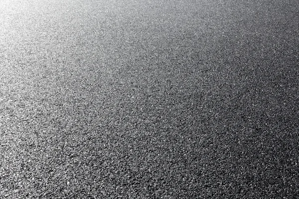 Close-up horizontal view of new asphalt road — Stock Photo, Image