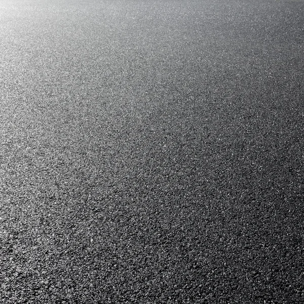 Close-up horizontal view of new asphalt road — Stock Photo, Image