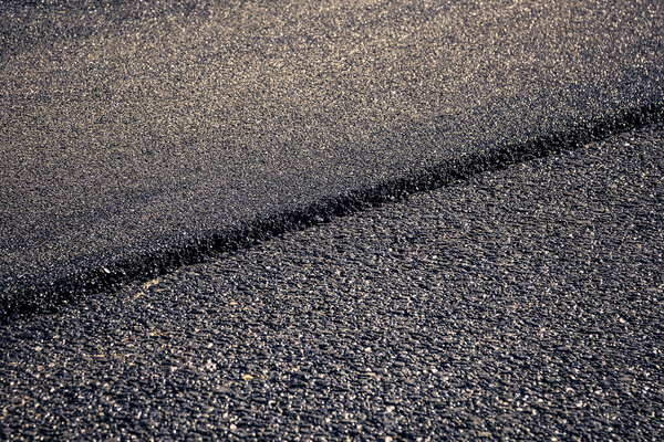 close-up horizontal view of new asphalt road