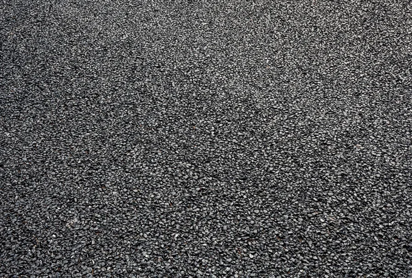 Close-up horizontal view of new asphalt road — Stock Photo, Image