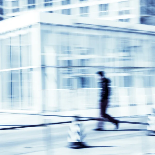 People walking in the business district,motion blur — Stock Photo, Image