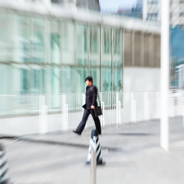 People walking in the business district, motion blur — стоковое фото