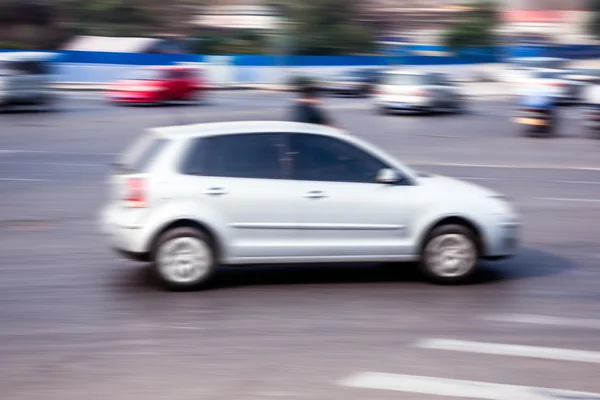 Bicycle riders in the city in motion blur — Stock Photo, Image