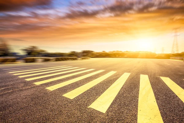 Motion blur of road at sunset — Stock Photo, Image