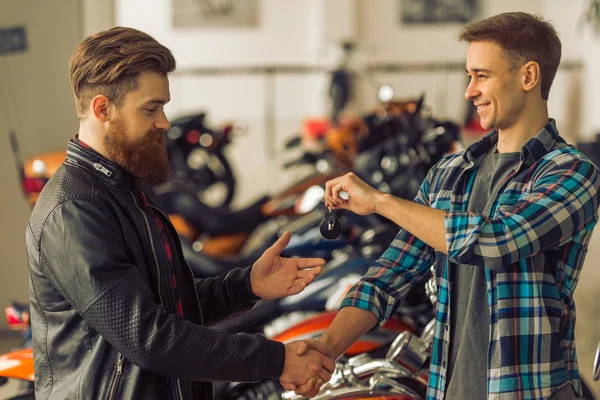 Men in motorbike salon