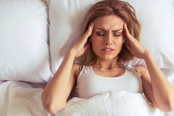 How a Poor Night's Sleep May Trigger Migraine Headaches | Stock Photo