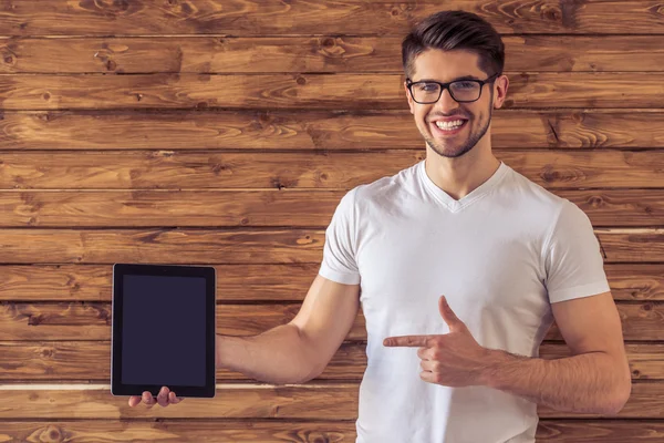 Handsome young man with gadget — Stock Photo, Image