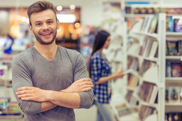 Young people at the book shop — Stock Photo, Image