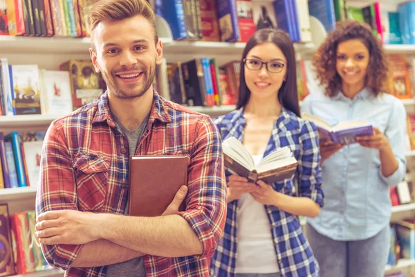 Young people at the book shop — Stock Photo, Image