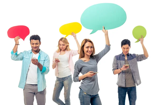 Students with speech bubbles and gadgets — Stock Photo, Image