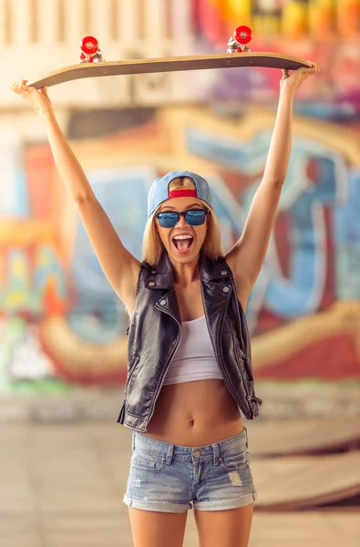 Beautiful skateboarding girl Stock Picture