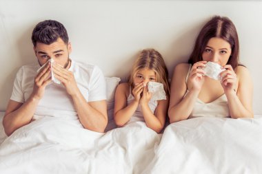 Family having common cold clipart