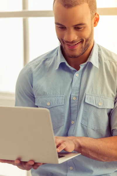 Afro American businessman with gadget — Stock Photo, Image