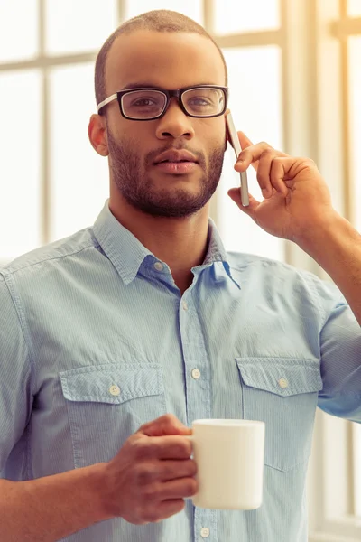 Afro American businessman with gadget — Stock Photo, Image