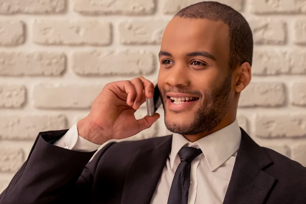 Afro American businessman with gadget — Stock Photo, Image