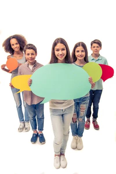 Teenagers with speech bubbles — Stock Photo, Image