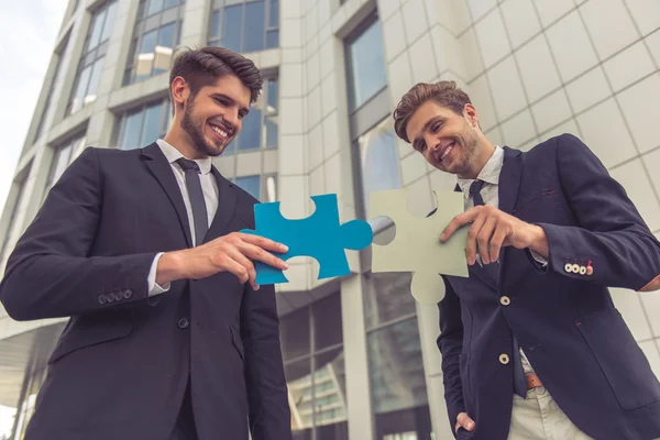 Handsome young businessmen with gadget — Stock Photo, Image