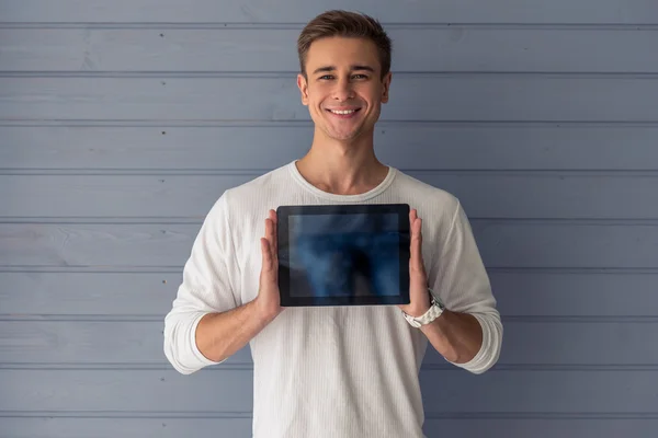 Handsome young man with gadget — ストック写真