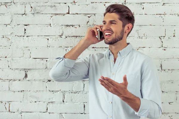 Handsome young businessman with gadget — Stock Photo, Image