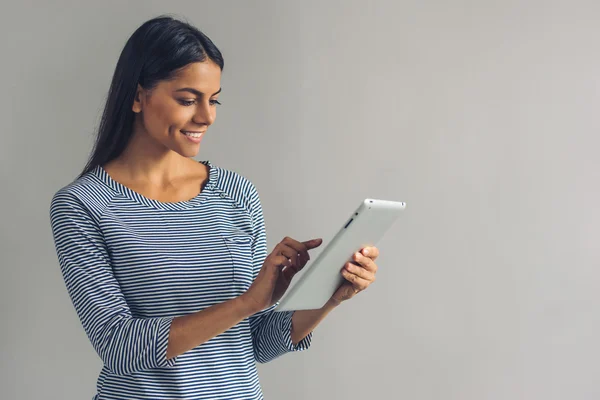 Beautiful young girl with gadget — Stock Photo, Image