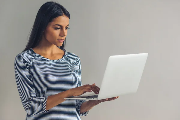 Beautiful young girl with gadget — Stock Photo, Image