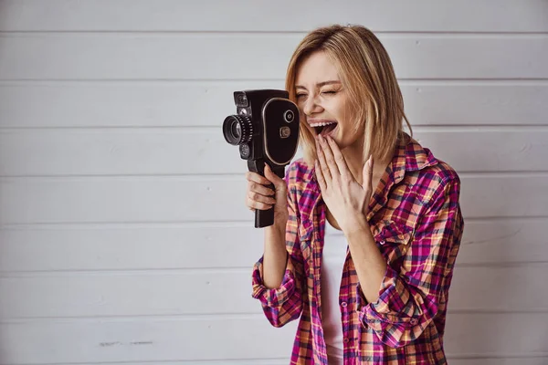 Young Emotional Girl While Shooting Old Camera Light Background — Stock Photo, Image