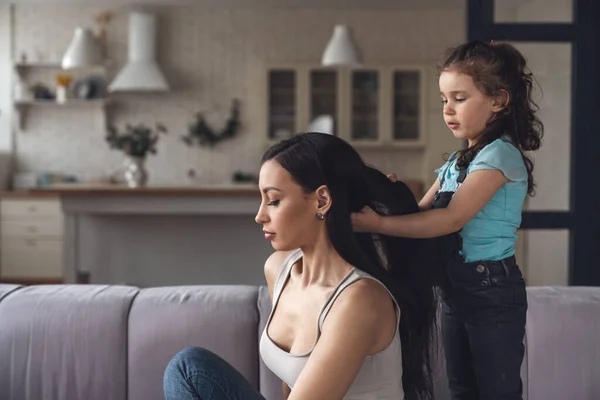 Little Baby Girl Makes Her Mother Hair Holding Her Hair — Stock Photo, Image